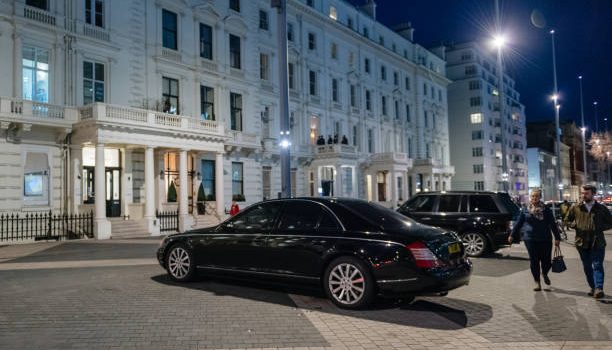 Luxury airport transfer car waiting outside Heathrow Airport in London.